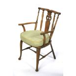 A 20th century oak framed armchair.