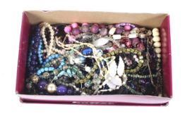 A box of assorted costume jewellery. To include necklaces and bangles, etc.