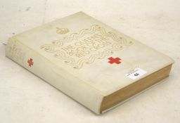 A volume of 'The Queen's Book of the Red Cross'.