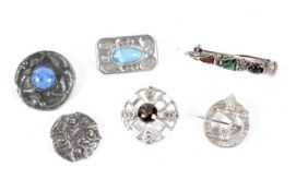 An assortment of six silver and white metal Scottish brooches. Various designs and stones.