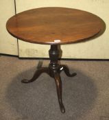 A 19th century oak tilt top table.