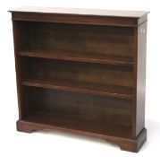 A mid-century Stag bookcase. With two adjustable shelves, raised on bracket supports, L95.