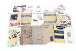A box of assorted collectables. Including cigarette cards, vintage cookery books advertising, etc.