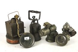 Five assorted spirit and carbide railway and cycle lanterns. Including a copper example stamped 'B.