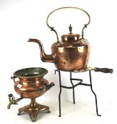 An early 20th century trivet stand, copper kettle and punch bowl.