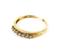 A yellow metal diamond dress ring stamped 375. Set with seven diamonds approx 0.