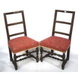 A pair of 19th century oak ladderback chairs.