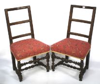 A pair of 19th century oak ladderback chairs.