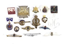 A collection of sixteen assorted military cap and sweetheart brooches.