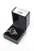 A 9ct and amethyst pebble dashed dress ring.