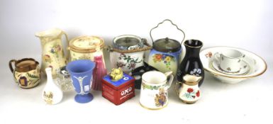 An assortment of collectables. Including biscuit barrels, Royal Doulton, Wedgwood, Wade, etc.