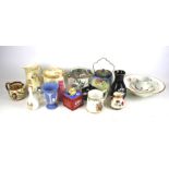 An assortment of collectables. Including biscuit barrels, Royal Doulton, Wedgwood, Wade, etc.