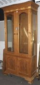 A contemporary pine display cabinet.