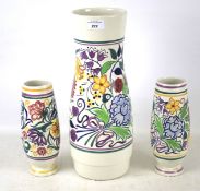 Three Poole pottery vases.