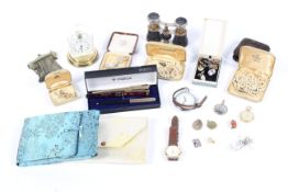 A box of assorted collectables and jewellery.