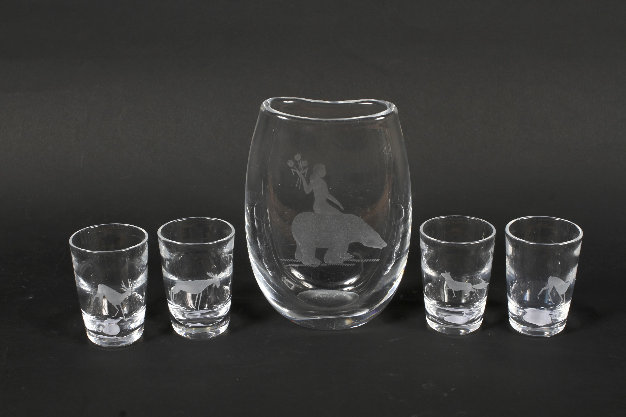 A mid-century Magnor (Norwegian) engraved glass vase and a set of four Kosta (Swedish) engraved