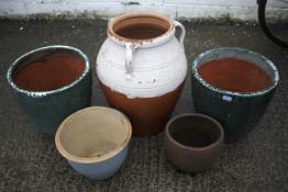 Four large gardening pots.