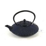 A cast iron Japanese squat teapot and cover.