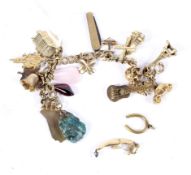 A vintage 9ct gold twin-curb 'charm' bracelet hung with 16 various charms.