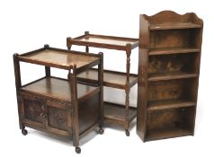 Two oak tea trolleys and a bookcase.