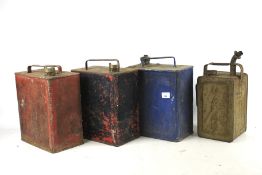 Four vintage petrol cans. Including two painted red with single handles to the top H32cm.