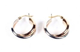 A pair of two tone 9ct gold hoop earrings, 3.4 grams.