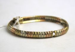 A 9ct tri-colour gold articulated bracelet, of domed design, 14.