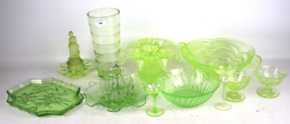 A large collection of Art Deco style pressed green uranium glassware.