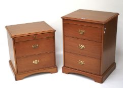 Two Stag bedside cabinets. A two-drawer and three-drawer example with swing handles. Tallest 73cm.