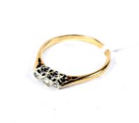 A vintage 9ct gold and diamond three stone ring. The round brilliant and eight-cut stones approx. 0.