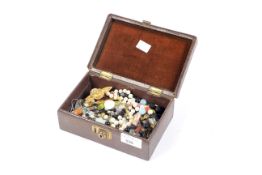 A box of assorted costume jewellery. To include necklaces, agate, brooches, etc.