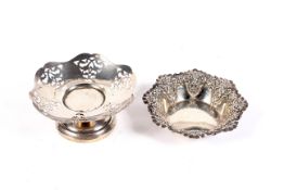 Two decorative silver dishes.