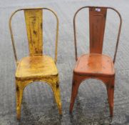 A pair of vintage cast metal garden chairs.