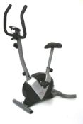 A Vfit exercise bike. Of metal construction with padded seat complete with screen L115 x H110cm.