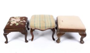 Three 19th century oak upholstered footstools. Including one with a drop-in embroidered seat.