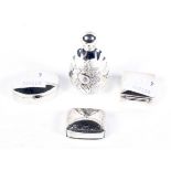 An assortment of silver. Comprising three silver pill boxes and a perfume bottle H6cm.