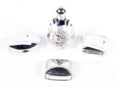 An assortment of silver. Comprising three silver pill boxes and a perfume bottle H6cm.