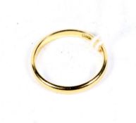 An 18ct gold wedding band size P. 2.5 grams.