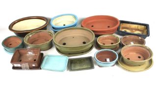 A collection of contemporary stoneware plant pots.
