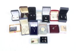 An assortment of boxed silver jewellery. Including earrings, necklace, pendants and brooches, etc.