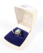 A 9ct pearl and teal ring. The centre stone surrounded by seed pearls (one missing) size Q, 3.