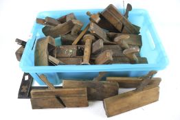 An assortment of woodwork tools. Including a set square, wood planes, etc.