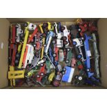 An assortment of playworn diecast model vehicles.