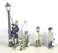 Five Lladro ceramic figures.