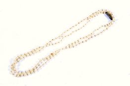 A cultured pearl single row necklace.