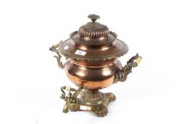 A vintage copper and brass twin handled samovar.