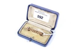A 9ct gold woven bar brooch set with seed pearls stamped 9ct. 3.3 grams.