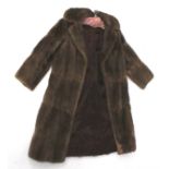 A ladies vintage brown fur coat.