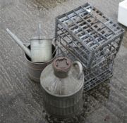 An assortment of galvanised metal items. Including watering cans, buckets, two racks, etc.