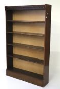 A modern mahogany bookcase. Comprising five shelves atop a solid base, L89cm x D20cm x H145cm.